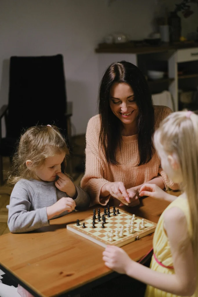 children analyzing chess game and learning from mistakes