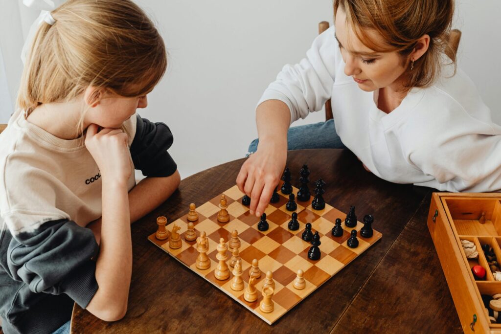 child thinking deeply while playing chess showing logical understanding